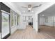 Bright living room with modern kitchen view, flooded with natural light and open floor plan at 101 Grand Plaza Dr # P6, Orange City, FL 32763