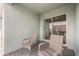 Relaxing outdoor balcony featuring two wicker chairs and sliding door to living room at 10221 Highline Crest St, Orlando, FL 32832