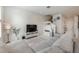 Spacious living room boasting modern furnishings, bright lighting, and a stylish entertainment center at 10221 Highline Crest St, Orlando, FL 32832