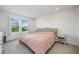 Comfortable bedroom featuring soft carpet, a cozy bed, and natural light from the windows at 10221 Highline Crest St, Orlando, FL 32832