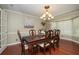 Dining room featuring a chandelier, large window, a table, and seating for six at 104 Forest Point Ln, Longwood, FL 32779