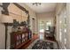 Inviting entryway with hardwood floors, decorative rug, stylish furniture, and a decorative wall hanging at 104 Forest Point Ln, Longwood, FL 32779