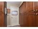 Hallway featuring convenient storage cabinets for ample storage and organization solutions at 104 Forest Point Ln, Longwood, FL 32779