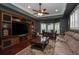 Spacious living room featuring custom built-ins, hardwood flooring, and ample seating at 104 Forest Point Ln, Longwood, FL 32779