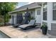 Seating area poolside with lounge chairs and decorative plants at 104 Forest Point Ln, Longwood, FL 32779