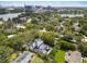 Stunning aerial view of the property, highlighting its proximity to a lake, lush greenery, and the surrounding cityscape at 1211 Munster St, Orlando, FL 32803