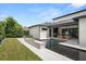 Well-designed backyard with a sleek pool, fire feature, and outdoor kitchen, perfect for relaxation and outdoor gatherings at 1211 Munster St, Orlando, FL 32803