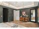 Stunning bedroom with wood floors, stylish decor, and multiple doors for easy access and abundant natural light at 1211 Munster St, Orlando, FL 32803