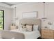 Bright bedroom featuring a neutral color palette, pendant lights, and stylish furnishings creating a serene atmosphere at 1211 Munster St, Orlando, FL 32803