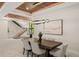 Dining room features a modern chandelier, an abstract painting, and access to the staircase at 1211 Munster St, Orlando, FL 32803