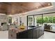 Sleek kitchen with a large island, modern appliances, and seamless indoor-outdoor living at 1211 Munster St, Orlando, FL 32803