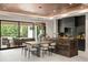 Contemporary kitchen features an island with seating, sleek cabinetry, and access to an outdoor living space at 1211 Munster St, Orlando, FL 32803