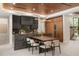 Modern kitchen features an island with seating, modern appliances, and wooden cabinetry at 1211 Munster St, Orlando, FL 32803