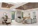 An elegant living room features a modern fireplace, designer lighting, and a dining area at 1211 Munster St, Orlando, FL 32803