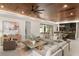 Open-concept living room featuring elegant furnishings, modern lighting, and seamless flow to the kitchen at 1211 Munster St, Orlando, FL 32803