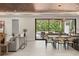 Bright open-concept living and dining area with sliding glass doors to a patio, and modern decor at 1211 Munster St, Orlando, FL 32803