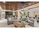 Open concept living room boasts a modern staircase and access to the kitchen and dining areas at 1211 Munster St, Orlando, FL 32803