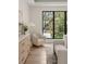 Sitting area in main bedroom featuring oversized windows, wood floors, and neutral colors at 1211 Munster St, Orlando, FL 32803