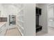 Bright and spacious walk-in pantry with custom shelving and stainless steel appliances at 1211 Munster St, Orlando, FL 32803