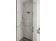 Elegant glass shower showcasing marble-look tile walls and modern shower fixtures in a stylish bathroom at 1211 Munster St, Orlando, FL 32803