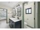 Modern bathroom with double vanity, stylish mirrors, and sleek fixtures at 1360 Gladiolas Dr, Winter Park, FL 32792