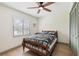 Bedroom boasts natural light, a ceiling fan, and a comfortable bed setup at 1360 Gladiolas Dr, Winter Park, FL 32792