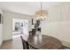 Open dining area showcasing a modern chandelier and access to other rooms at 1360 Gladiolas Dr, Winter Park, FL 32792