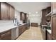 Spacious kitchen featuring stainless steel appliances, ample counter space, and sleek cabinetry at 1360 Gladiolas Dr, Winter Park, FL 32792