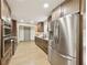 Spacious kitchen featuring stainless steel appliances and modern countertops at 1360 Gladiolas Dr, Winter Park, FL 32792