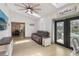 Bright living room with comfortable seating and glass doors leading to outdoor area at 1360 Gladiolas Dr, Winter Park, FL 32792