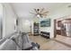 Comfortable living room with a ceiling fan, large sofa, and an open layout connecting to the kitchen at 1360 Gladiolas Dr, Winter Park, FL 32792