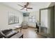 Cozy living room featuring a ceiling fan, comfortable seating, and lots of windows at 1360 Gladiolas Dr, Winter Park, FL 32792