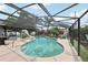 Enclosed pool features a slide, hot tub, and outdoor seating area, perfect for relaxation and entertainment at 1360 Gladiolas Dr, Winter Park, FL 32792
