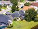 Aerial view of the home showcasing the backyard, screened lanai, and surrounding neighborhood at 14377 Lord Barclay Dr, Orlando, FL 32837
