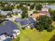 Aerial view of the home showcasing the backyard, screened lanai, and surrounding neighborhood at 14377 Lord Barclay Dr, Orlando, FL 32837