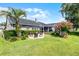 Beautiful backyard featuring a screened lanai, paved patio, and lush landscaping, perfect for outdoor entertaining at 14377 Lord Barclay Dr, Orlando, FL 32837