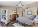 A bedroom featuring a four-poster bed, a door to the outside, and a wall-mounted television at 14377 Lord Barclay Dr, Orlando, FL 32837