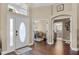 Elegant foyer with hardwood floors and views of the office and bathroom at 14377 Lord Barclay Dr, Orlando, FL 32837