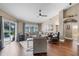 Bright living room with comfortable seating, hardwood floors, and sliding doors that provide pool views at 14377 Lord Barclay Dr, Orlando, FL 32837