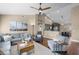 Inviting living room with comfortable seating, modern decor, and a view of the kitchen and dining area at 14377 Lord Barclay Dr, Orlando, FL 32837