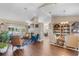 Spacious living room with a fireplace, hardwood floors, and built-in bookshelves at 14377 Lord Barclay Dr, Orlando, FL 32837
