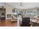 Bright and airy living room features a stone fireplace, hardwood floors, and backyard views at 14377 Lord Barclay Dr, Orlando, FL 32837