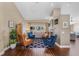Cozy living room with fireplace, hardwood floors, and ample natural light at 14377 Lord Barclay Dr, Orlando, FL 32837
