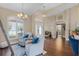 Bright and airy living room with high ceilings, hardwood floors, and views of the foyer at 14377 Lord Barclay Dr, Orlando, FL 32837