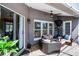 The outdoor patio boasts wicker seating and a ceiling fan, making it an inviting area for entertaining guests and relaxing at home at 14377 Lord Barclay Dr, Orlando, FL 32837