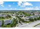 Aerial view of a well-planned neighborhood with manicured lawns, mature trees, and homes with pools at 14880 Ellingsworth Ln, Winter Garden, FL 34787