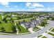 Stunning aerial perspective of a modern neighborhood, complete with green spaces and well-maintained homes at 14880 Ellingsworth Ln, Winter Garden, FL 34787