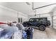 Spacious garage featuring a black car and ample storage space for all your needs at 14880 Ellingsworth Ln, Winter Garden, FL 34787