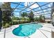 Sparkling pool with screened enclosure, tropical landscaping, spa, and plenty of sunshine at 14880 Ellingsworth Ln, Winter Garden, FL 34787