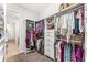 Organized walk-in closet with ample storage, shelving, and hanging space for clothing and accessories at 14880 Ellingsworth Ln, Winter Garden, FL 34787